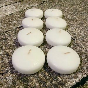 8 floating white candles unscented 2.85”